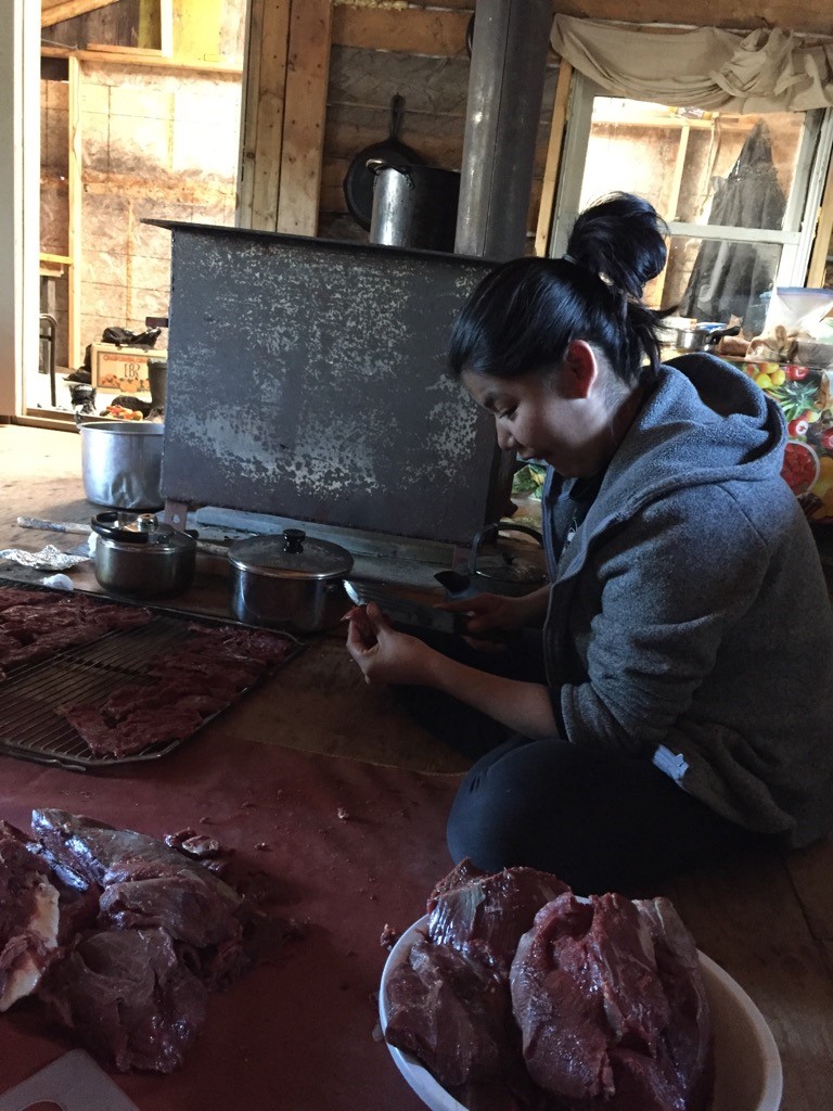 Girl cutting meat